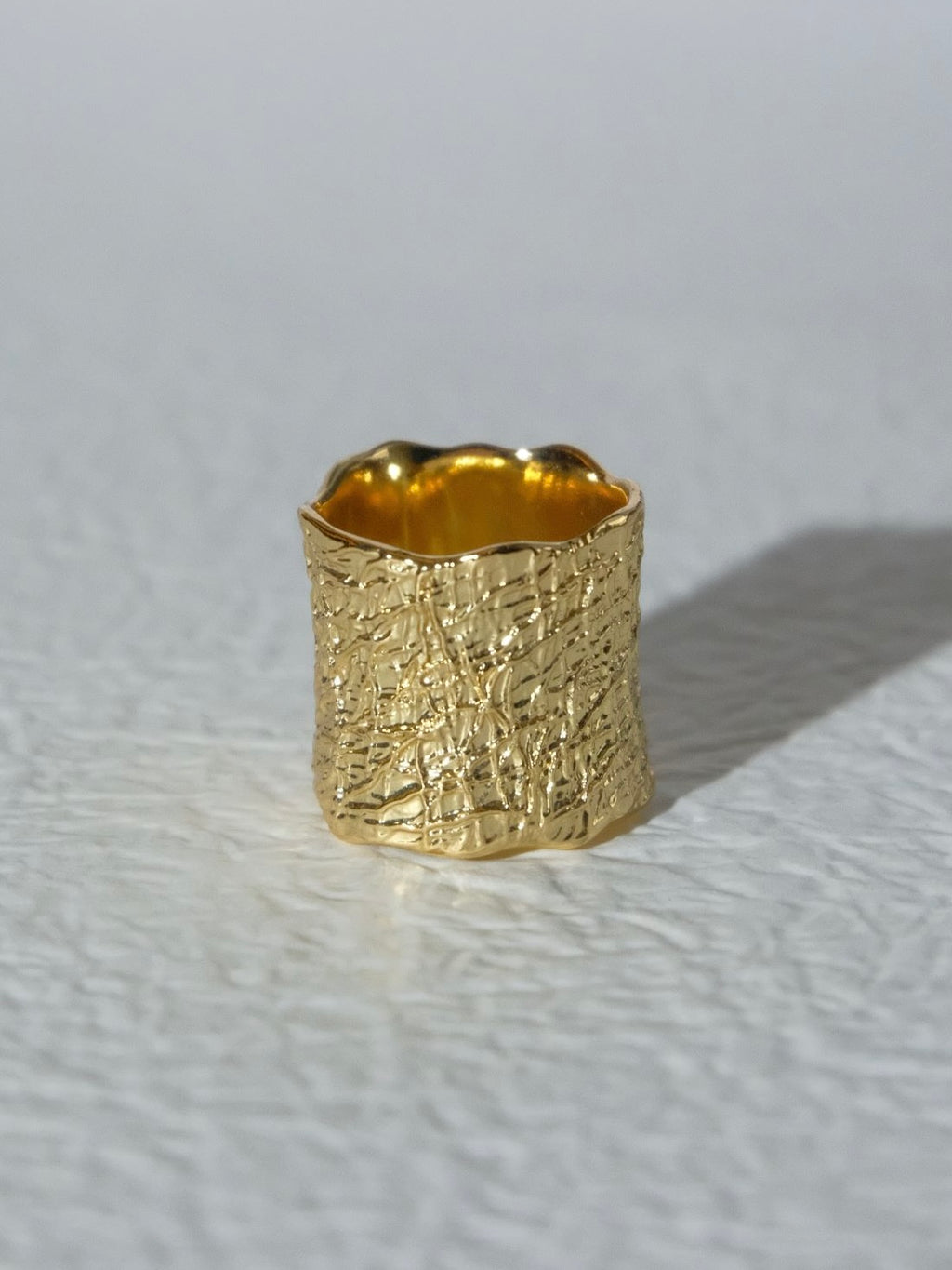 Volcanic rock texture with wide openings, bright golden