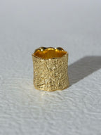 Volcanic rock texture with wide openings, bright golden