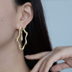 Zircon-encrusted sea wave wind chime earrings