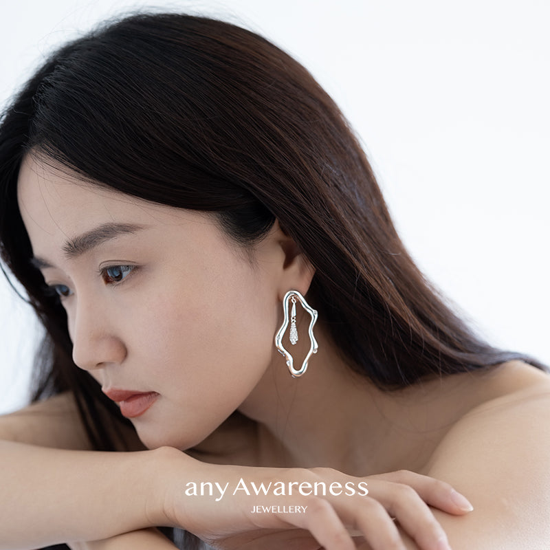 Zircon-encrusted sea wave wind chime earrings