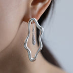 Zircon-encrusted sea wave wind chime earrings