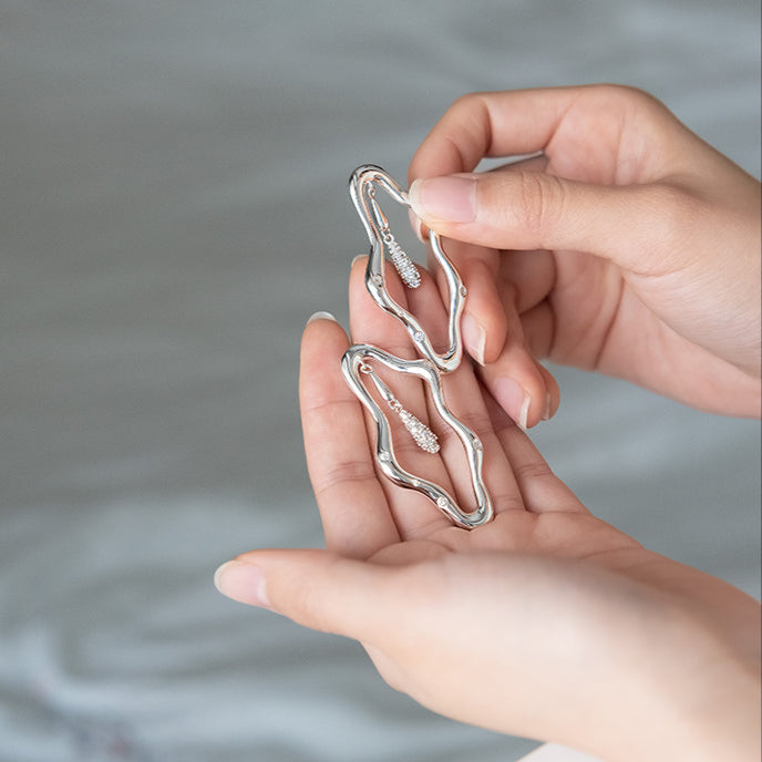 Zircon-encrusted sea wave wind chime earrings