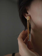 Asymmetric temple column tassel earrings